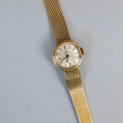Montre de dame Tissot vintage en or jaune 18 carats sertie de diamants