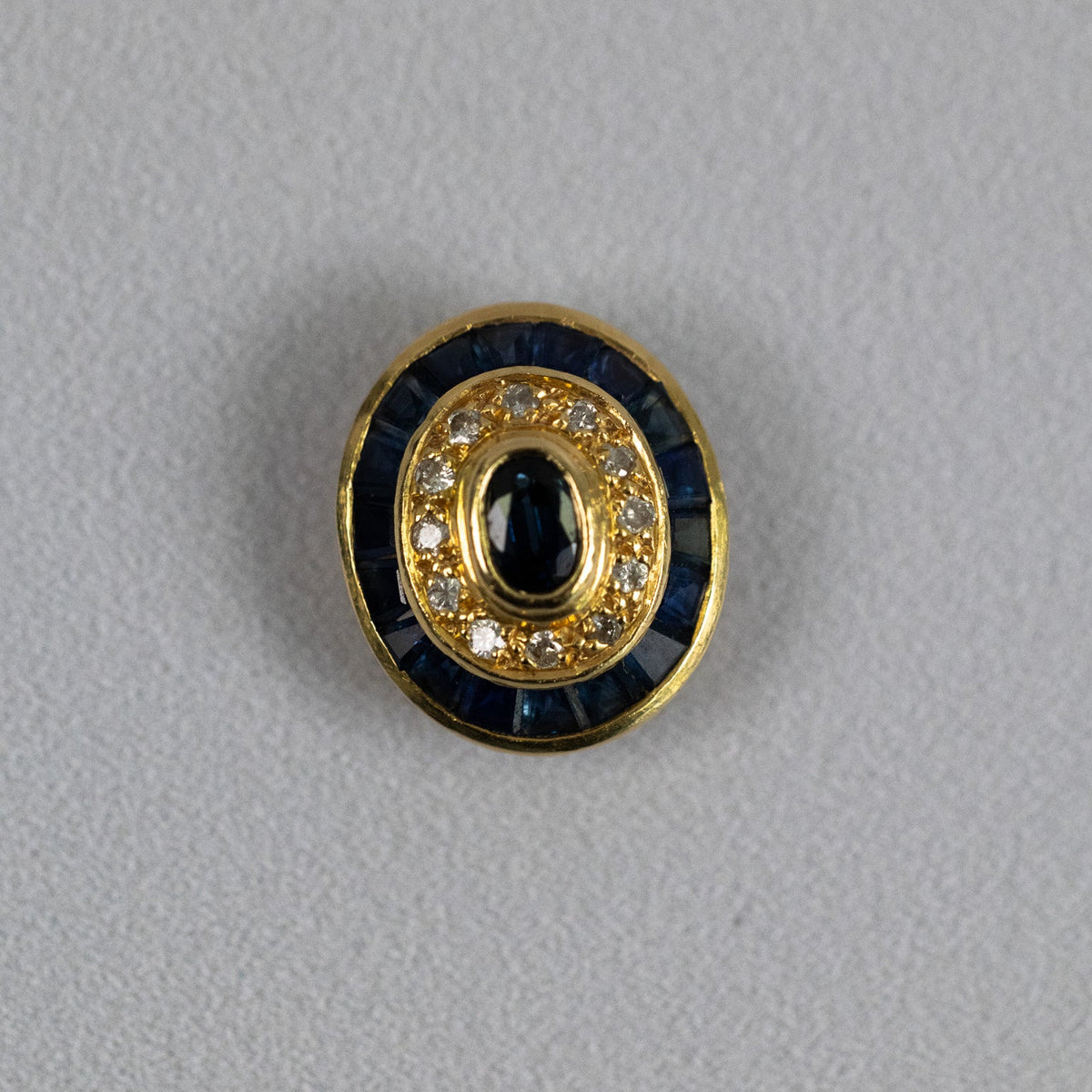 Pendentif ovale style Art Déco en or jaune 18 carats serti de saphirs et diamants