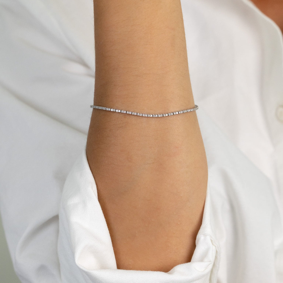Fermoir à cliquet et double huit de sécurité du bracelet tennis fin