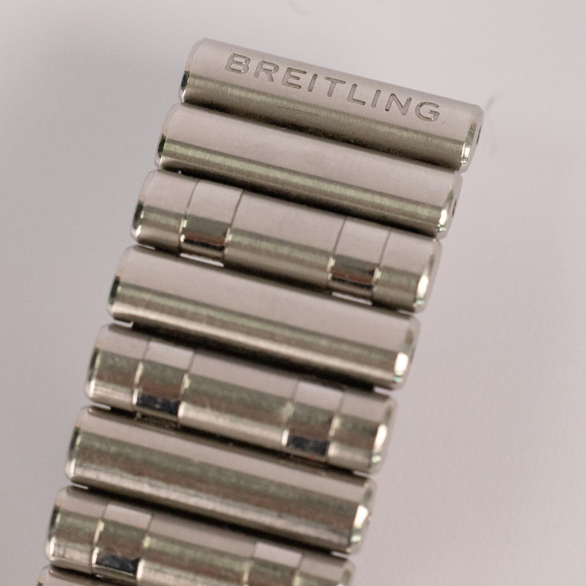 Lunette acier à cavaliers de la montre Breitling Chronomat 32 mm