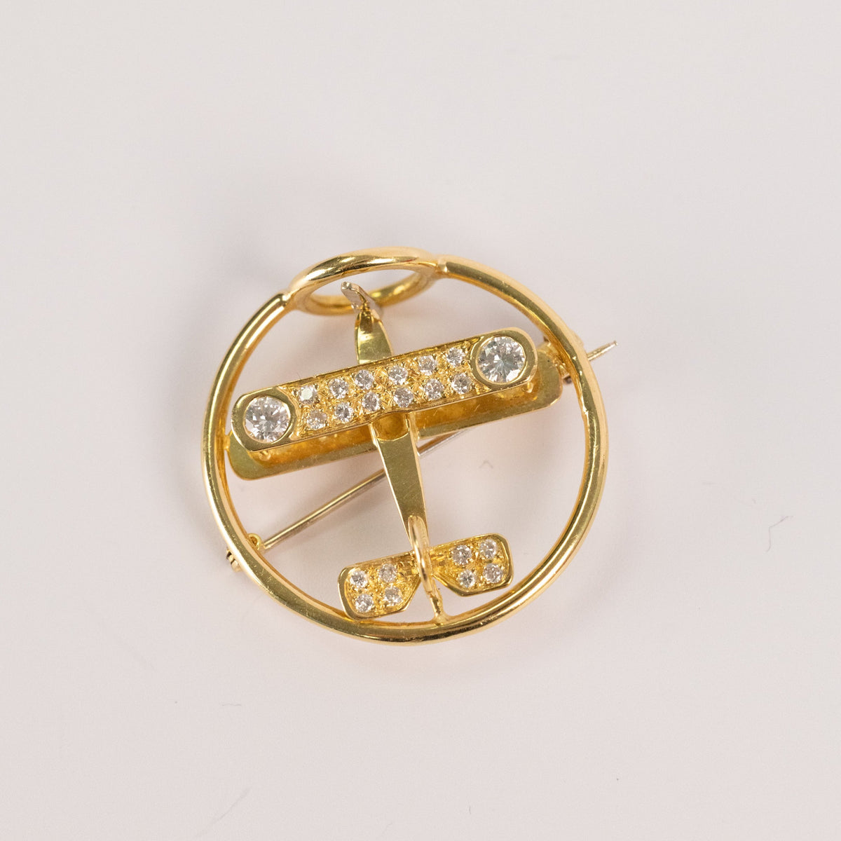 Broche avion vintage en or jaune et diamants, années 1940